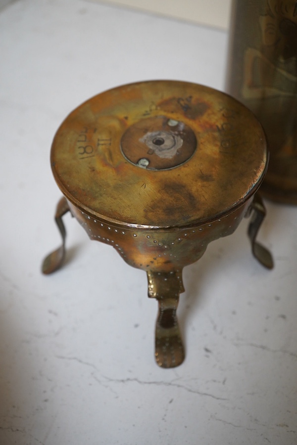 Trench Art, an engraved brass shell case, a similar box engraved ‘Ypres’ and a trivet, largest 50cm high. Condition - fair/good